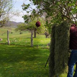 Kim Shooting with a Ghillie Blanket for Cover